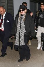 MADONNA Arrives at JFK Airport in New York 12/08/2023
