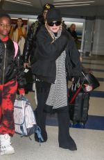 MADONNA Arrives at JFK Airport in New York 12/08/2023