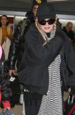 MADONNA Arrives at JFK Airport in New York 12/08/2023