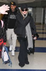 MADONNA Arrives at JFK Airport in New York 12/08/2023
