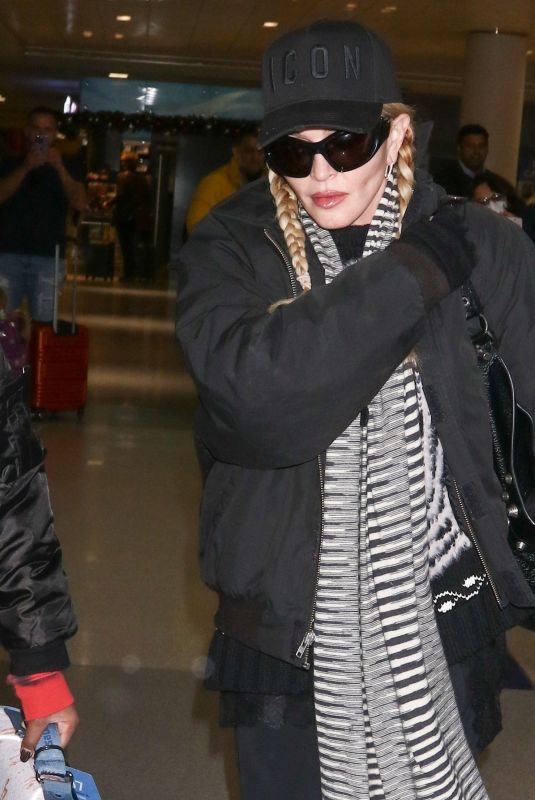 MADONNA Arrives at JFK Airport in New York 12/08/2023