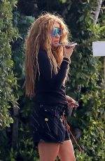 SHAKIRA Out to Make a Phone Call in Miami Beach 12/02/2023