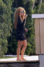 SHAKIRA Out to Make a Phone Call in Miami Beach 12/02/2023