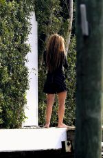SHAKIRA Out to Make a Phone Call in Miami Beach 12/02/2023