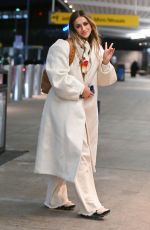 TATE MCRAE Arrives at JFK Airport in New York 12/12/2023