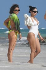 VANESA HUDGENS and SARAH HYLAND in Bikinis at a Beach in Tulum 12/04/2023