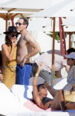 WENDI DENG MURDOCH with Her New Boyfriend on the Beach in St Barts 12/26/2023