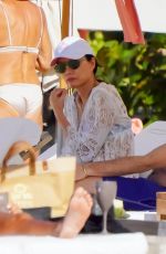 WENDI DENG MURDOCH with Her New Boyfriend on the Beach in St Barts 12/26/2023