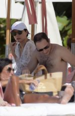 WENDI DENG MURDOCH with Her New Boyfriend on the Beach in St Barts 12/26/2023