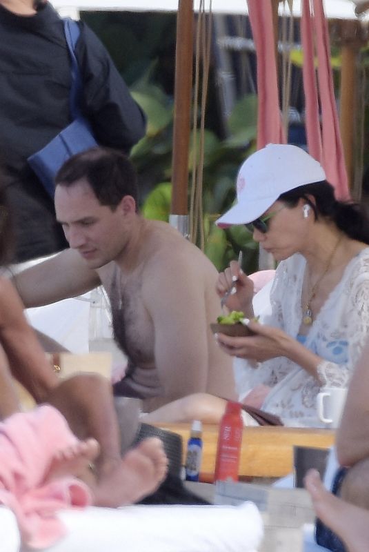 WENDI DENG MURDOCH with Her New Boyfriend on the Beach in St Barts 12/26/2023