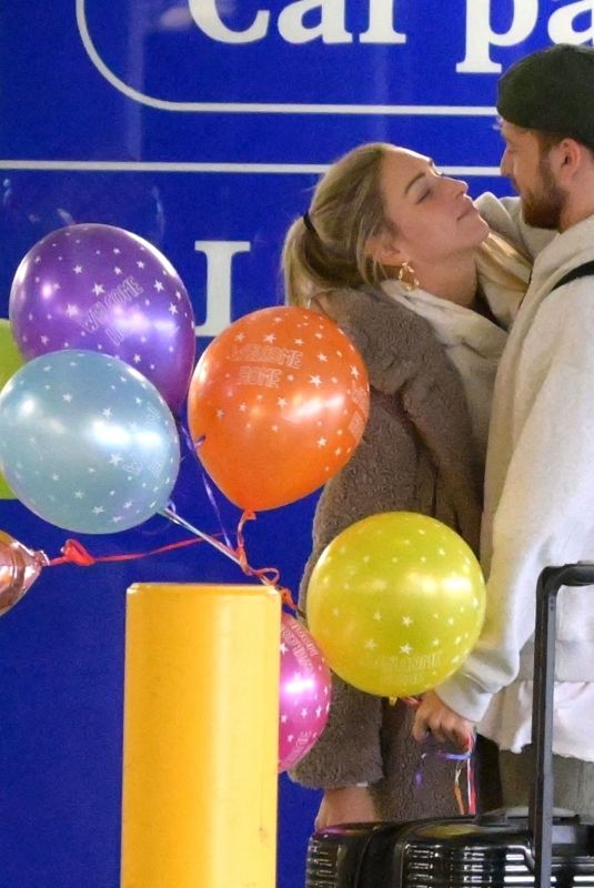 ZARA MCDERMOTT and Sam Thompson at London’s Heathrow Airport 12/13/2023