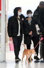 ARIANA GRANDE Arrives at JFK Airport in New York 01/21/2024