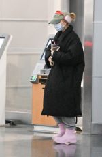 ARIANA GRANDE Arrives at JFK Airport in New York 01/27/2024