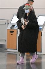 ARIANA GRANDE Arrives at JFK Airport in New York 01/27/2024