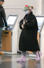 ARIANA GRANDE Arrives at JFK Airport in New York 01/27/2024