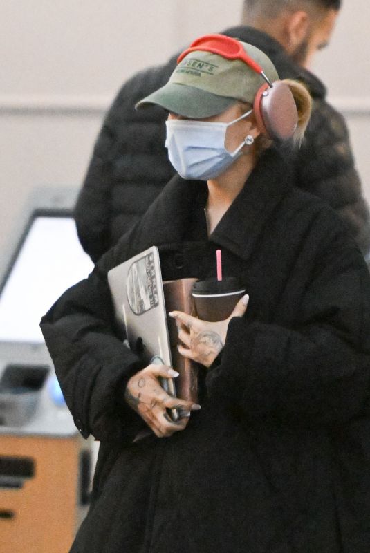 ARIANA GRANDE Arrives at JFK Airport in New York 01/27/2024