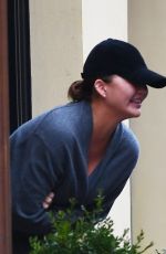 CHRISSY TEIGEN Shares a Moment of Laughter in New York 01/26/2024