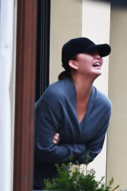CHRISSY TEIGEN Shares a Moment of Laughter in New York 01/26/2024