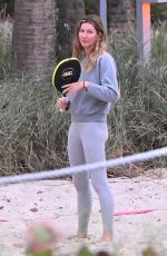 GISELE BUNDCHEN Playing Beach Tennis in Miami 01/17/2024