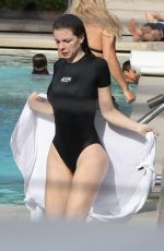 JULIA FOX in Swimsuit at a Pool in Miami 01/04/2024