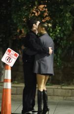 KATARINA DEME Squats on Sidewalk while Waiting for Her Car in Beverly Hills 01/19/2024