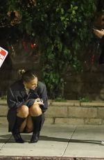 KATARINA DEME Squats on Sidewalk while Waiting for Her Car in Beverly Hills 01/19/2024