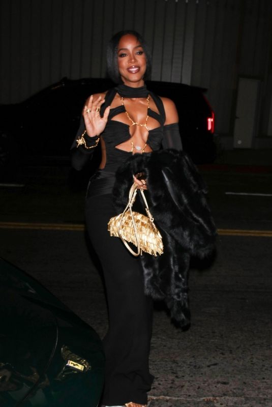 KELLY ROWLAND Celebrates Tim Weatherspoon