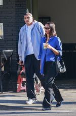 LAURA HARRIER and Sam Jarou Out with Their Dog in Los Angeles 01/30/2024