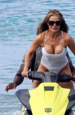LIZZIE CUNDY in Swimsuit Jet Skiing in Barbados 01/01/2024