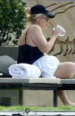 REBEL WILSON in Swimsuit at a Pool at Her Hotel in Sydney 01/05/2024