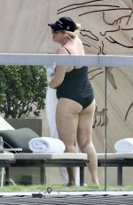 REBEL WILSON in Swimsuit at a Pool at Her Hotel in Sydney 01/05/2024