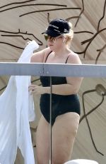 REBEL WILSON in Swimsuit at a Pool at Her Hotel in Sydney 01/05/2024