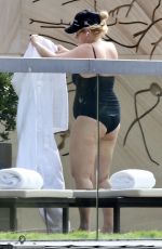 REBEL WILSON in Swimsuit at a Pool at Her Hotel in Sydney 01/05/2024