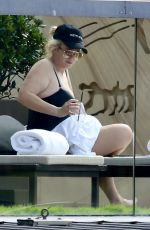 REBEL WILSON in Swimsuit at a Pool at Her Hotel in Sydney 01/05/2024