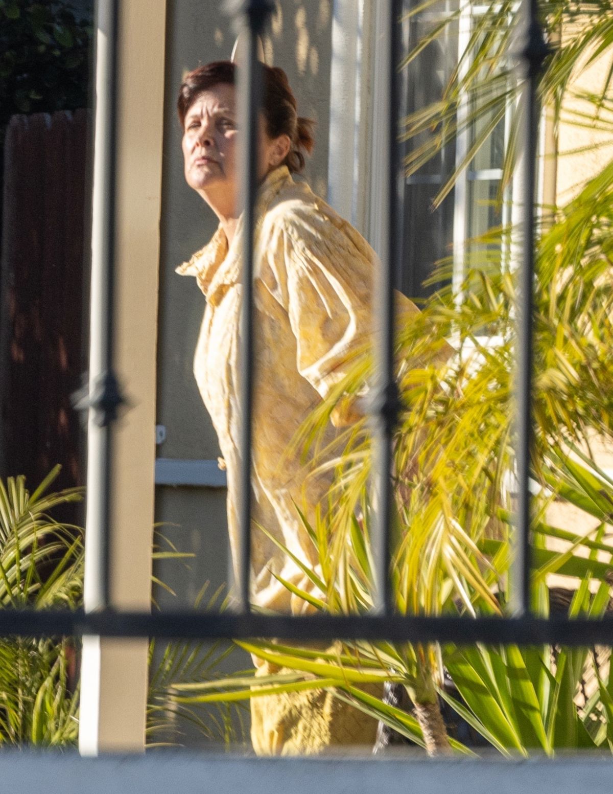 SHERILYN FENN Enjoying a Smoke Outside Her Home in Los Angeles 01/11 ...