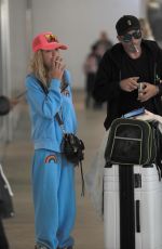 TARA REID and Nathan Montpetit-Howar at LAX in Los Angeles 01/19/2024