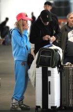 TARA REID and Nathan Montpetit-Howar at LAX in Los Angeles 01/19/2024