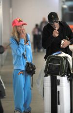 TARA REID and Nathan Montpetit-Howar at LAX in Los Angeles 01/19/2024