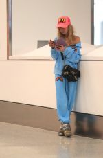 TARA REID and Nathan Montpetit-Howar at LAX in Los Angeles 01/19/2024