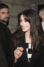 ANNE HATHAWAY Leaves Versace Fashion Show Milan 02/23/2024