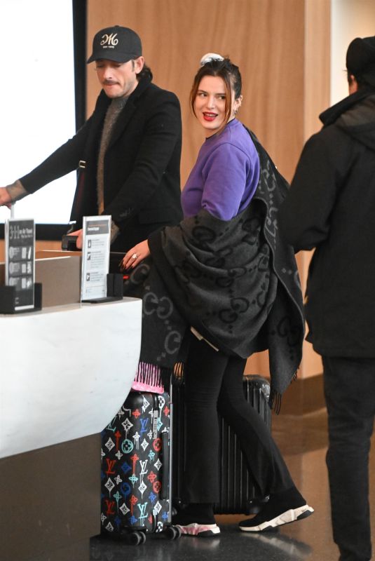 BELLA THORNE Arrives at JFK Airport in New York 02/16/2024