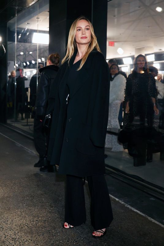 BRIE LARSON Arrives at Michael Kors Fashion Show in New York 02/13/2024