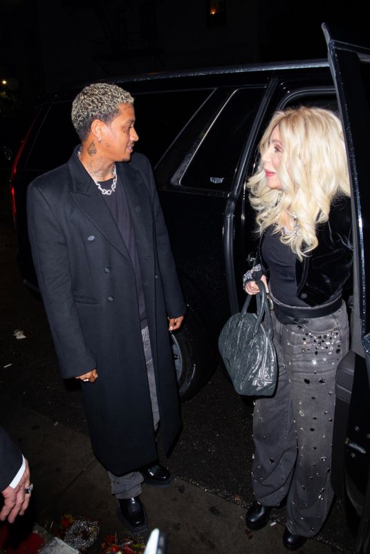 CHER and Alexander A.E. Edwards Arrives at Warner Bros Music Pre-Grammy Party at Hollywood Athletic Club in Los Angeles 02/01/2024