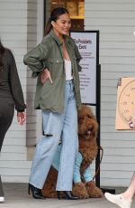 CHRISSY TEIGEN Helping Her Kids Sell Girl Scout Cookies in Los Angeles 02/17/2024