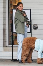 CHRISSY TEIGEN Helping Her Kids Sell Girl Scout Cookies in Los Angeles 02/17/2024