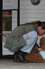 CHRISSY TEIGEN Helping Her Kids Sell Girl Scout Cookies in Los Angeles 02/17/2024