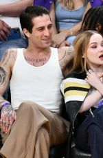 DOVE CAMERON and Damiano David at Los Angeles Lakers vs Detroit Pistons Game in Los Angeles 02/13/2024