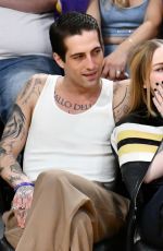 DOVE CAMERON and Damiano David at Los Angeles Lakers vs Detroit Pistons Game in Los Angeles 02/13/2024