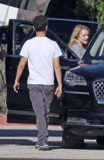 ELISABETH MOSS Gets a Hug from Max Minghella Following Her Pregnancy Announcement in Los Angeles 01/31/2024