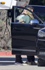 ELISABETH MOSS Gets a Hug from Max Minghella Following Her Pregnancy Announcement in Los Angeles 01/31/2024